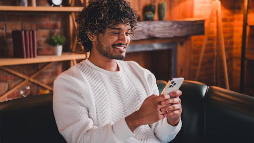 User with virtual assistant on smartphone